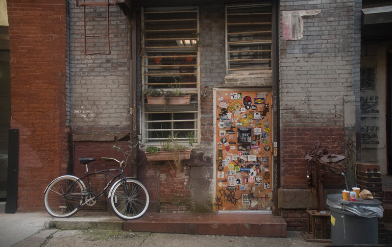 A door, covered with stickers.