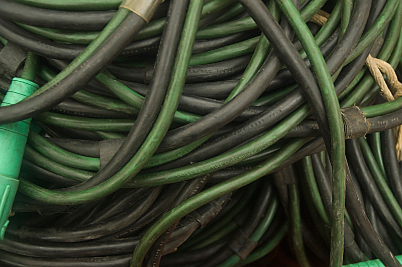 Thick black and green electrical cables.