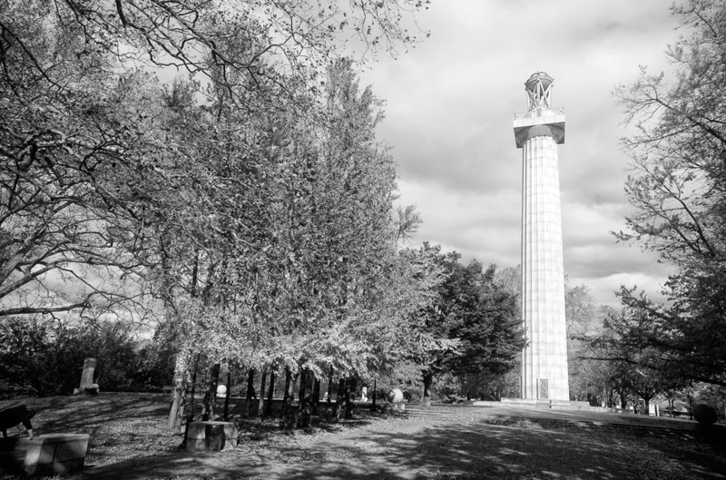 A tall column on a plaza