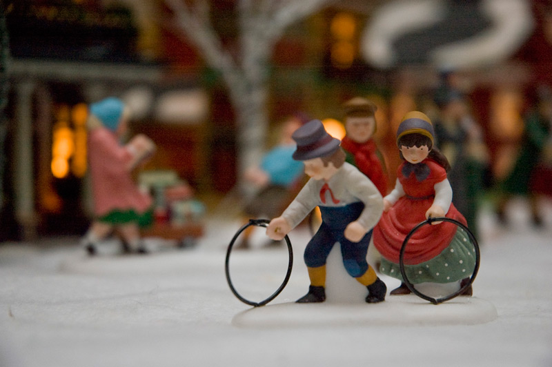 Figurines of children rolling hoops