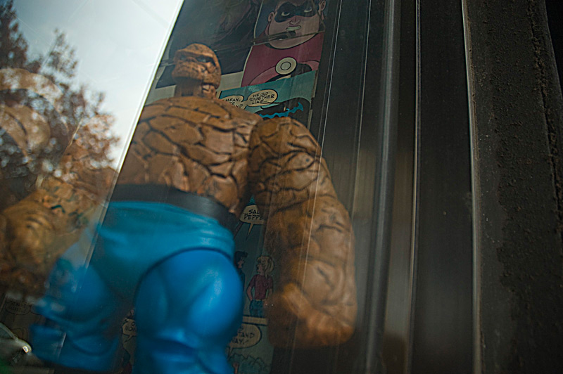 A comic book action figure in a store window
