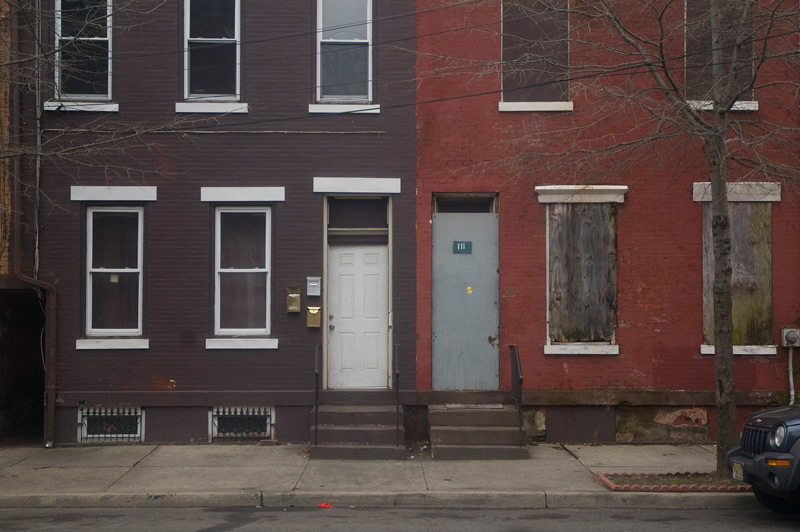 Doors of two brick homes