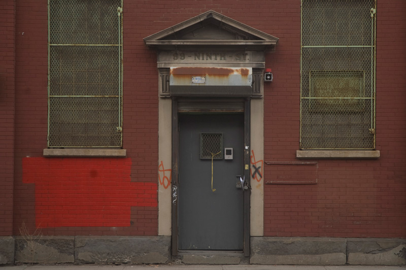 Door of an industrial building, with an elaborate jamb