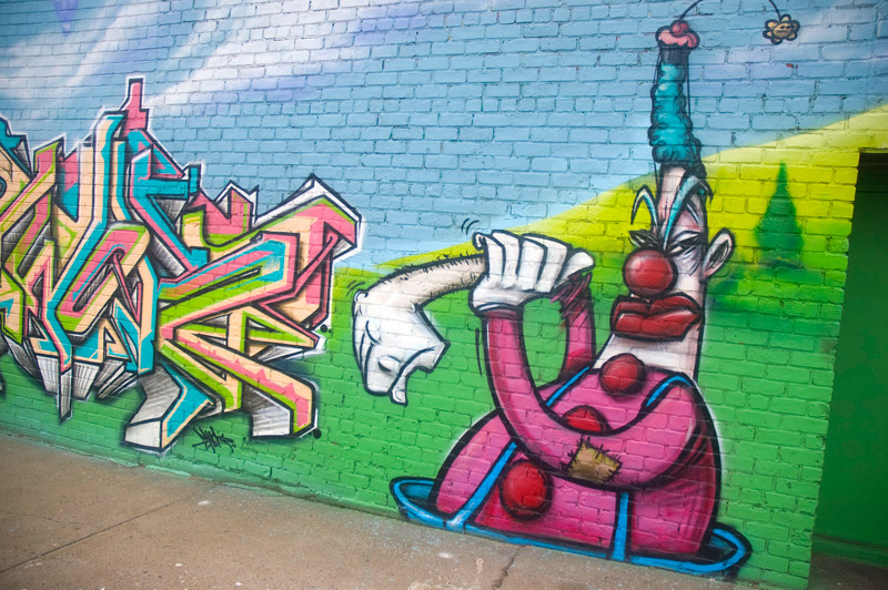Clown on a mural preparing to box.