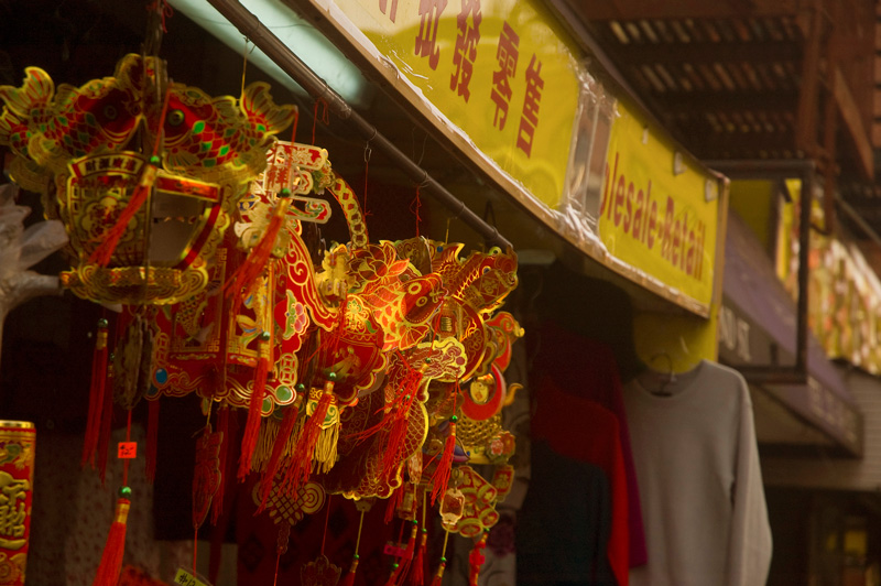 Red decorations for Chinese New Year hang outside a store.