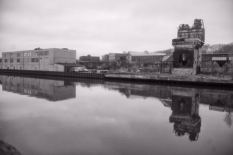 A creek and old industrial buildings