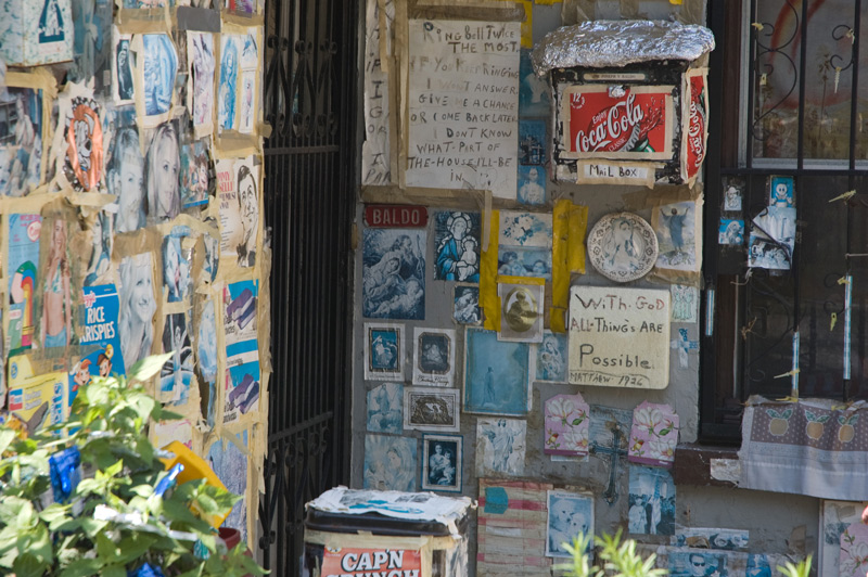 A building covered in a collage of clippings