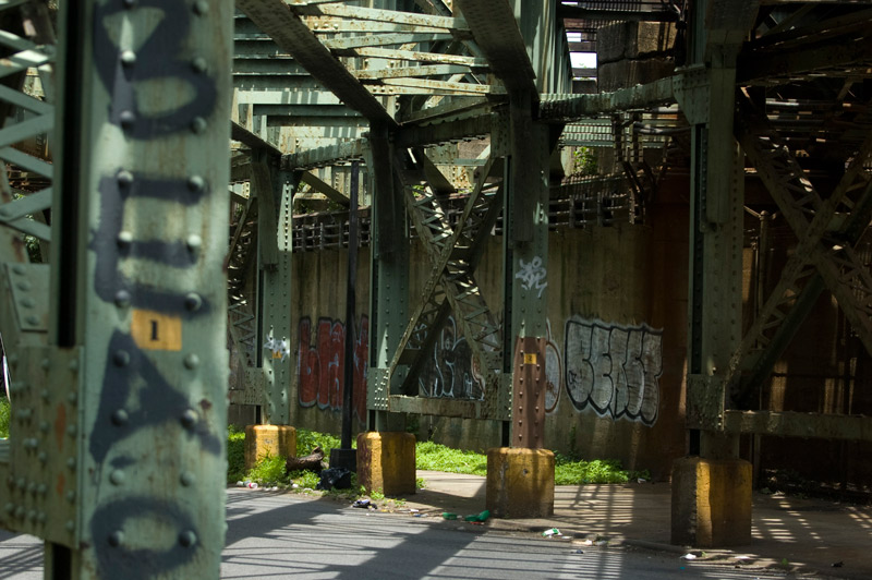 Girders and shadows under elevated subway tracks