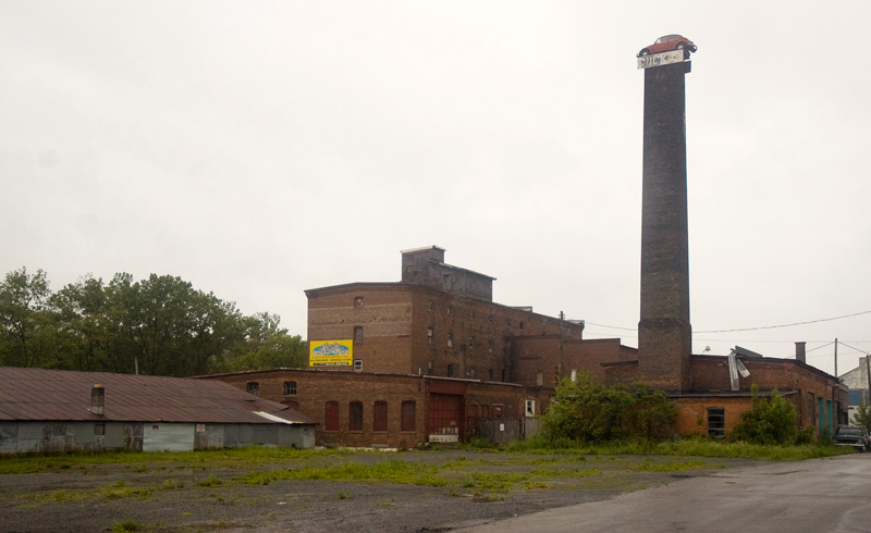 A car atop a smokestack