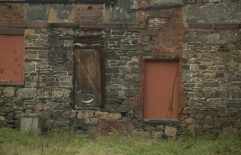 Two doors in the side of stone building