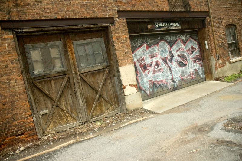 Doors in an alley, and graffiti