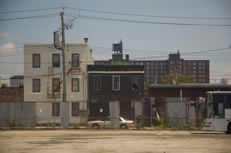 Houses opposite an empty parking lot