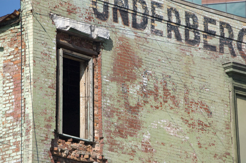 A dilapidated brick building.