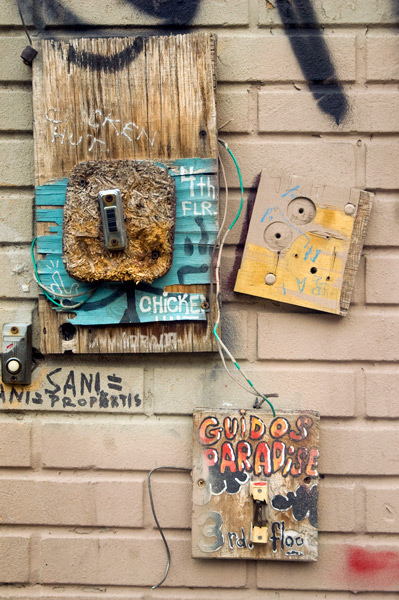 Assorted buzzers on a wall.