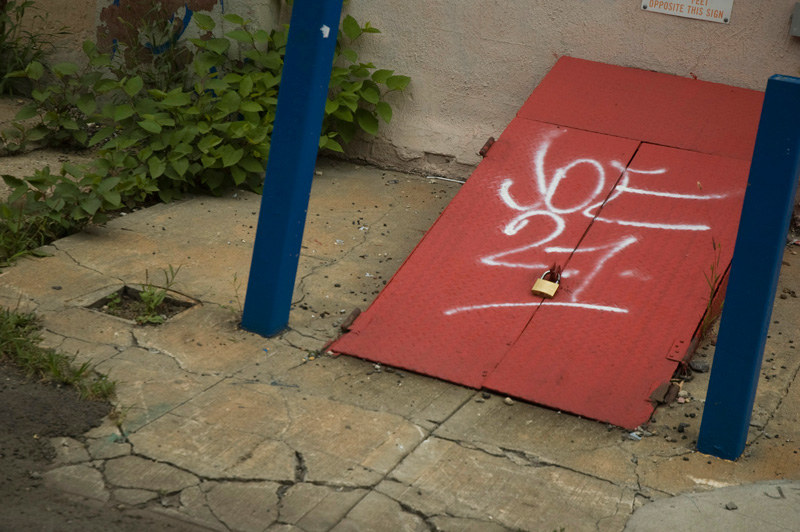 A graffiti tag on a basement door.