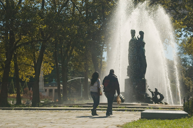 An ornate water fountain in a plaza.