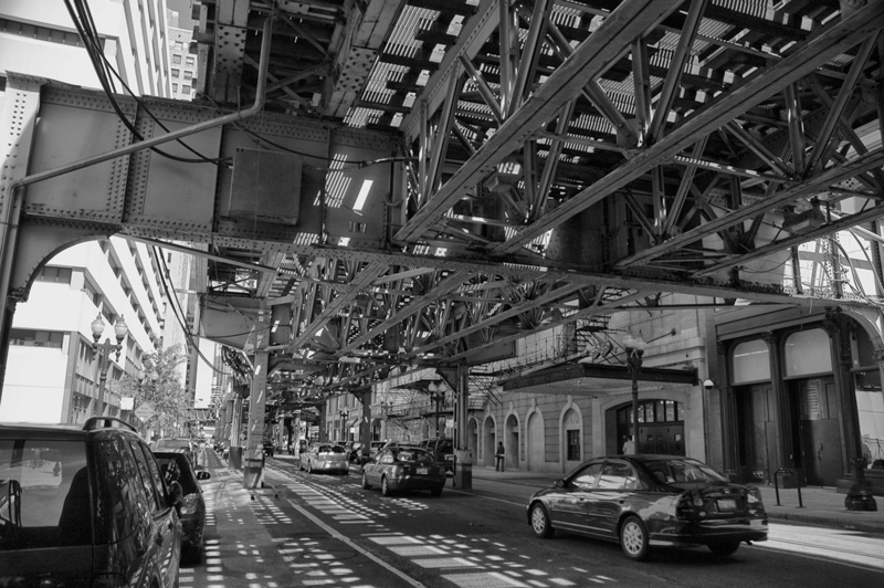 An elevated train track in Chicago, and its shadows.