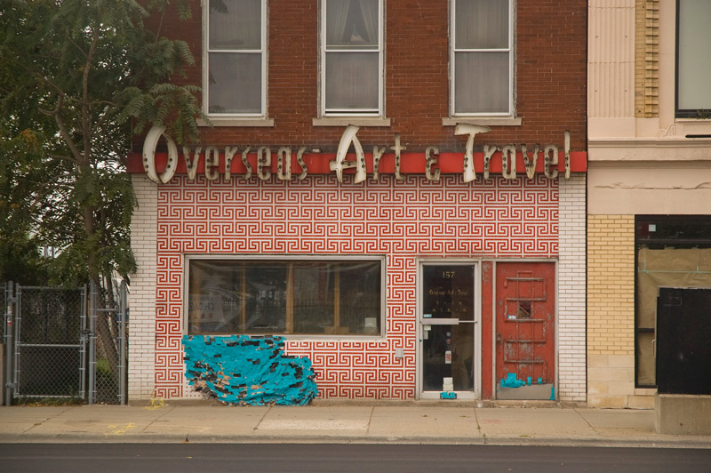 An empty, red storefront.