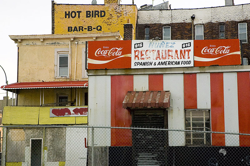 An old restaurant with red and white stripes.