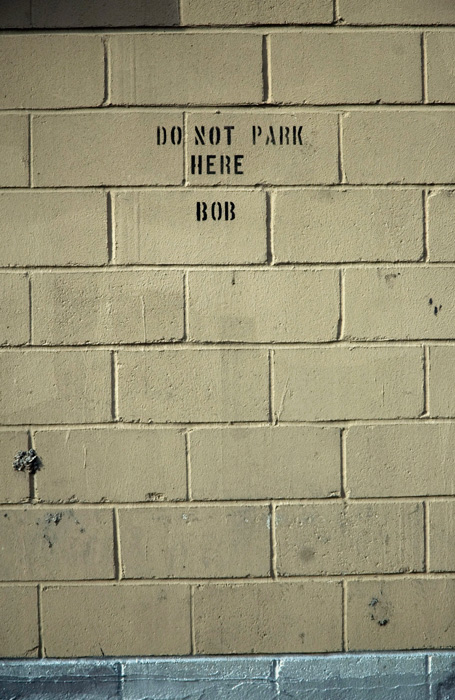 Stenciled letters over Bob's parking spot.