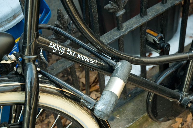 'enjoy the moment,' painted on a bike.