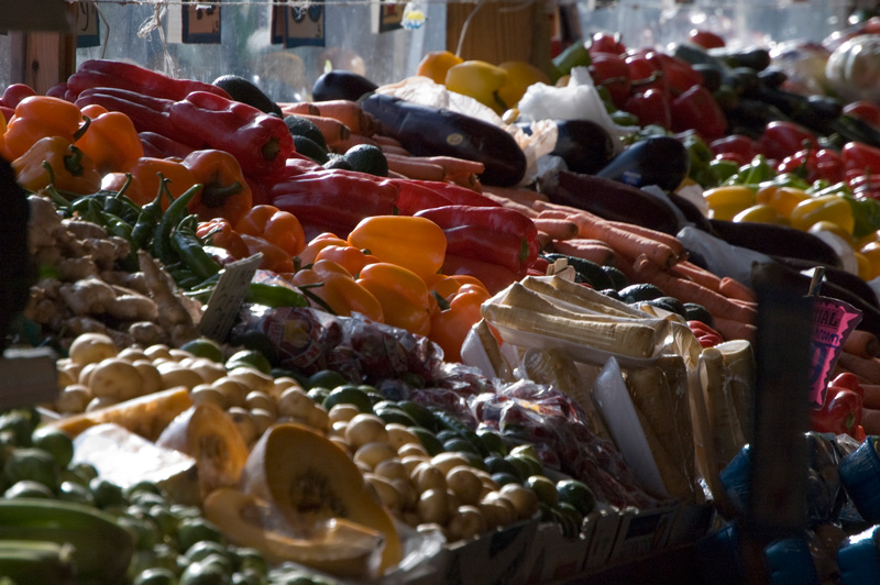 Orange and red bell peppers, in sunlight.