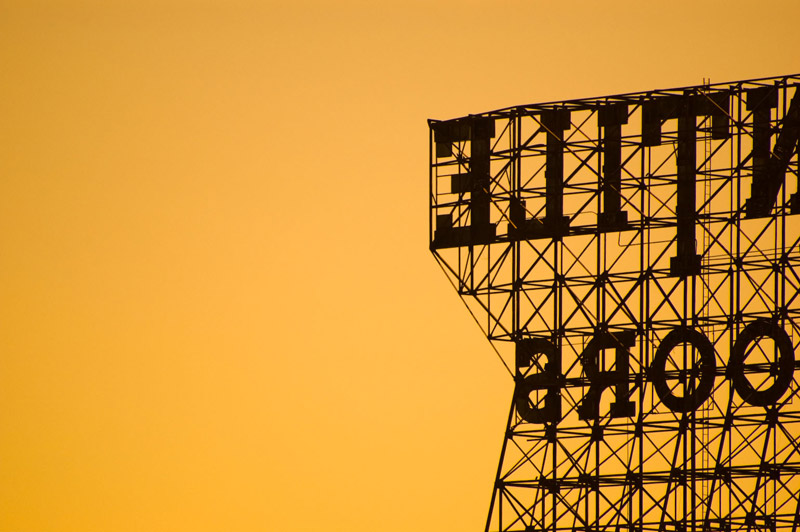 A portion of the Kentile Floors sign, in silhouette.