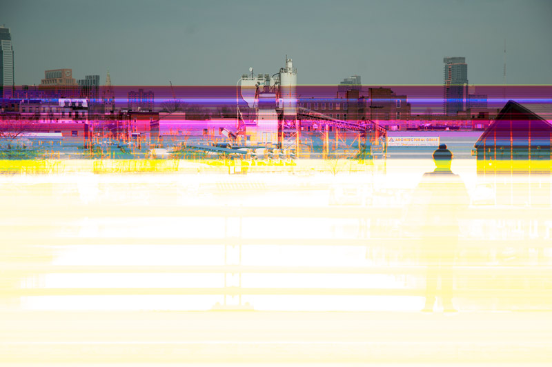 Corrupted picture of a person at a bridge.
