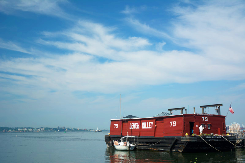 Blue skies over a docked barge.