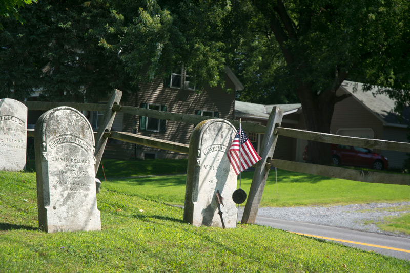 Old tombstones close to a street.