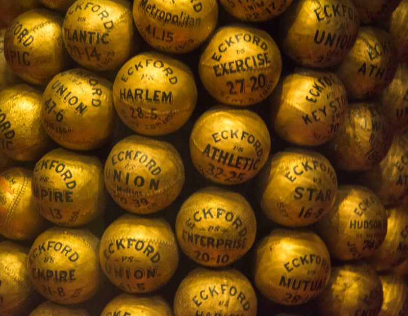 Baseballs, painted gold and marking victories.