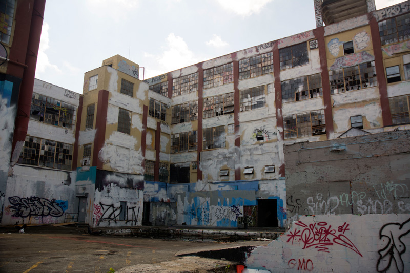 A building, with whitewash covering its graffiti