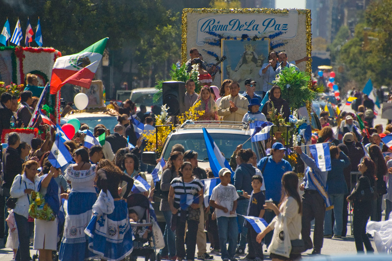 A parade float and celebrants