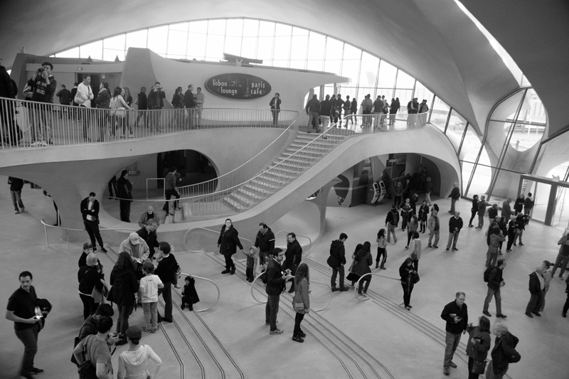 People milling around in the curved TWA Flight Center