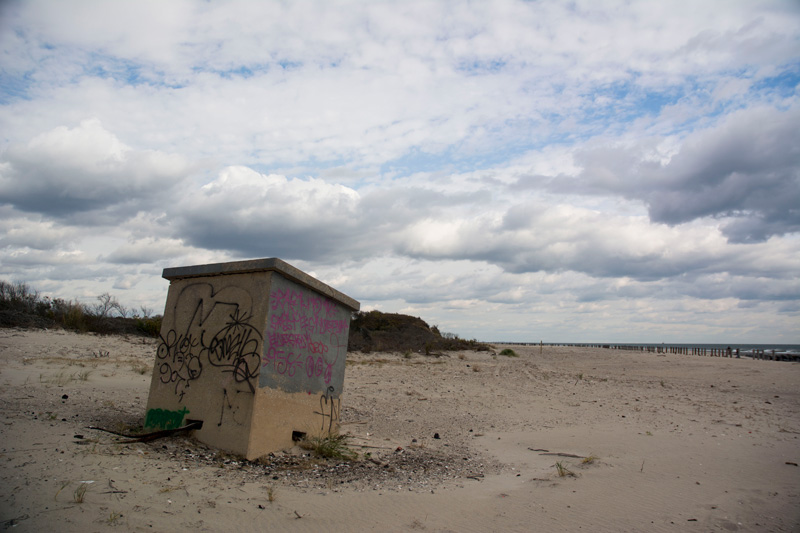 A block of concrete on a beach.