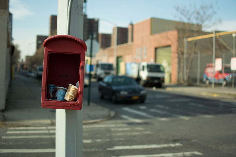 Paper cups in an abandoned fire call box.