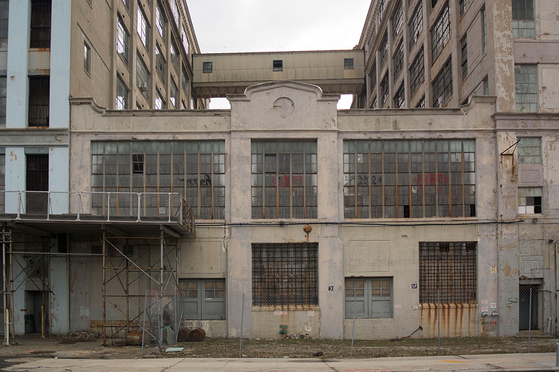 An old industrial building among warehouses.