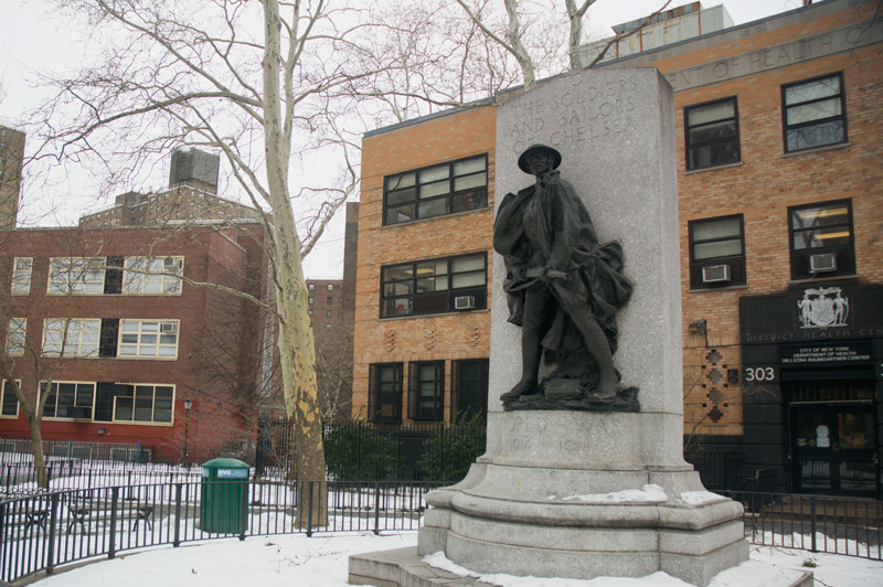 A memorial to World War I soldiers, surrounded by snow.