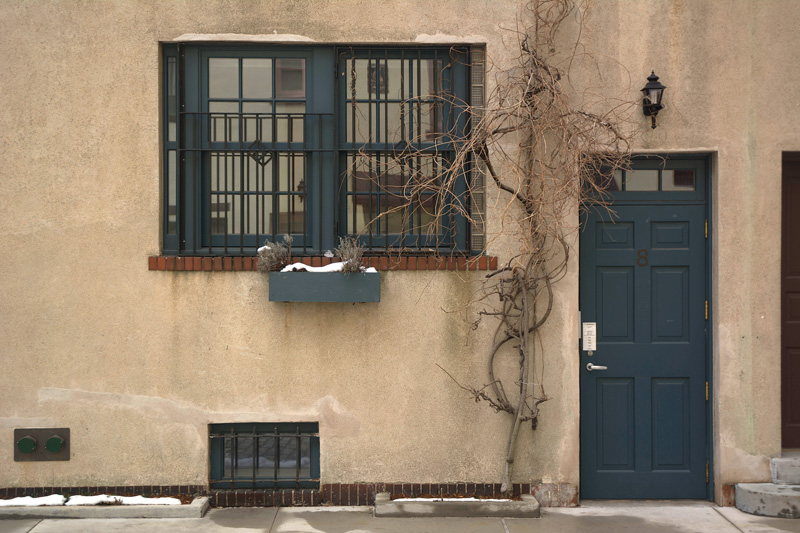 Color-coordinated door and window, with remnants of snow.