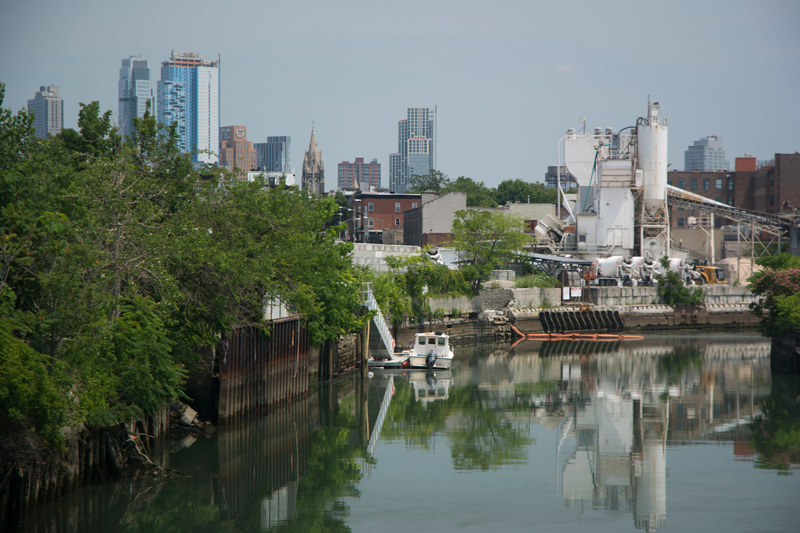 Skyscrapers rising beyond the Gowanus Canal.