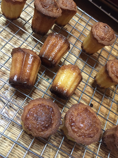 Canelles on a cooling rack.