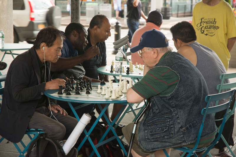 Chess players poring over their boards.