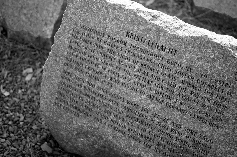 A stone in a Holocaust Memorial explains the history of Kristallnacht.