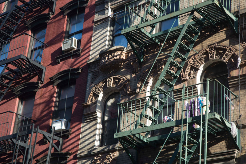 A tenement fire escape, with drying clothes.