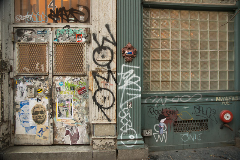 Graffiti on the entrance of a building.