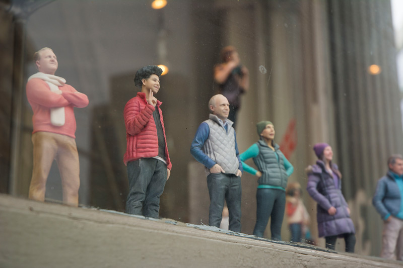 Figurines of common people, posed as if for a portrait, using three dimensional printing.