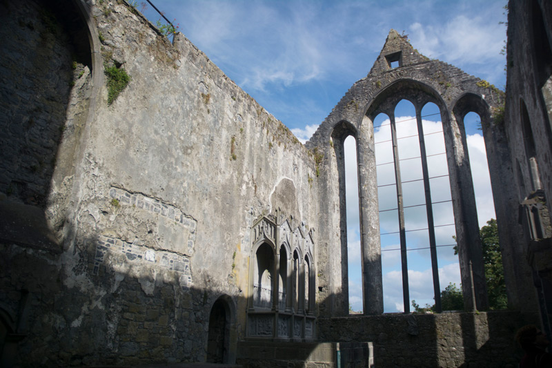 Sun streams through the of the old friary in Ennis, Ireland.