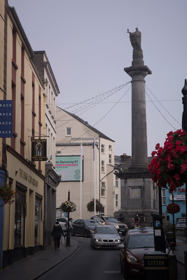 A statue of Daniel O'Connell stands on top of a tall column.