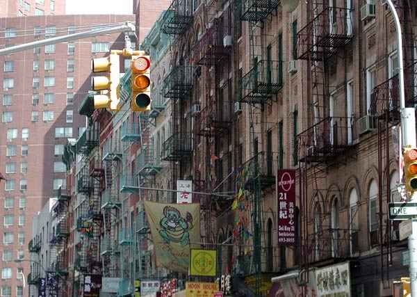 Rows of residential
buildings on a colorful Chinatown street.