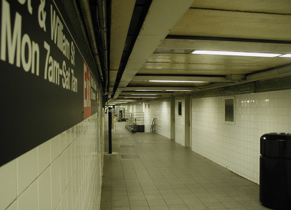 A subway hall,
with a sign on the left.